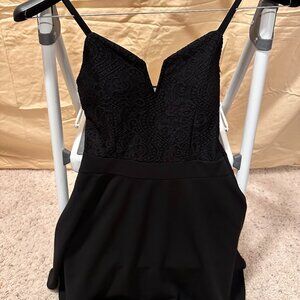 Black mini skater dress with lace on top all around/see-through back